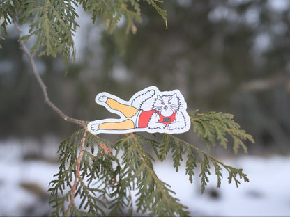 cedaero slender james sticker on a tree branch with a snowy background